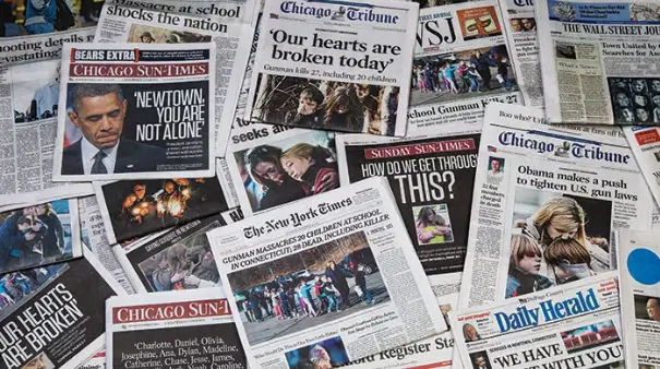 Collection of newspaper headlines covering national tragedies, used to illustrate media awareness and crisis response in security guard training