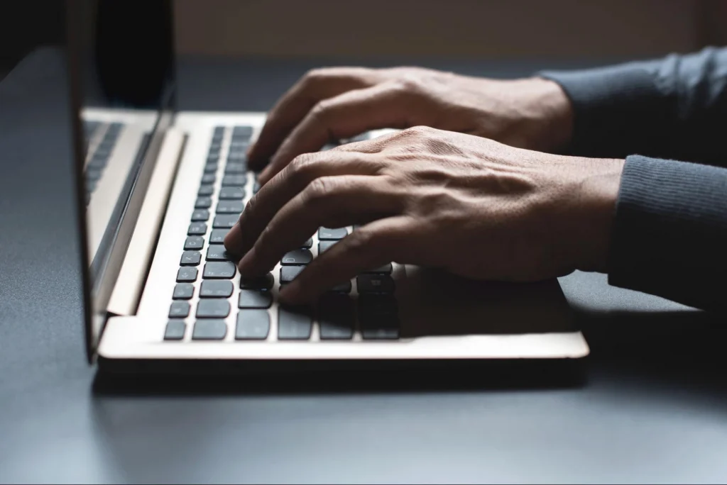Person completing online security training on laptop with Guard Training platform