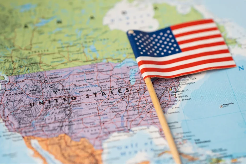United States map with American flag representing online security guard training requirements by state