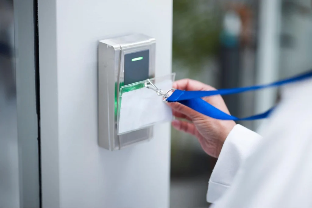 Access Control Skills for Security Guard Training | Guard Training Person scanning an ID badge at an electronic access control reader during security guard training.